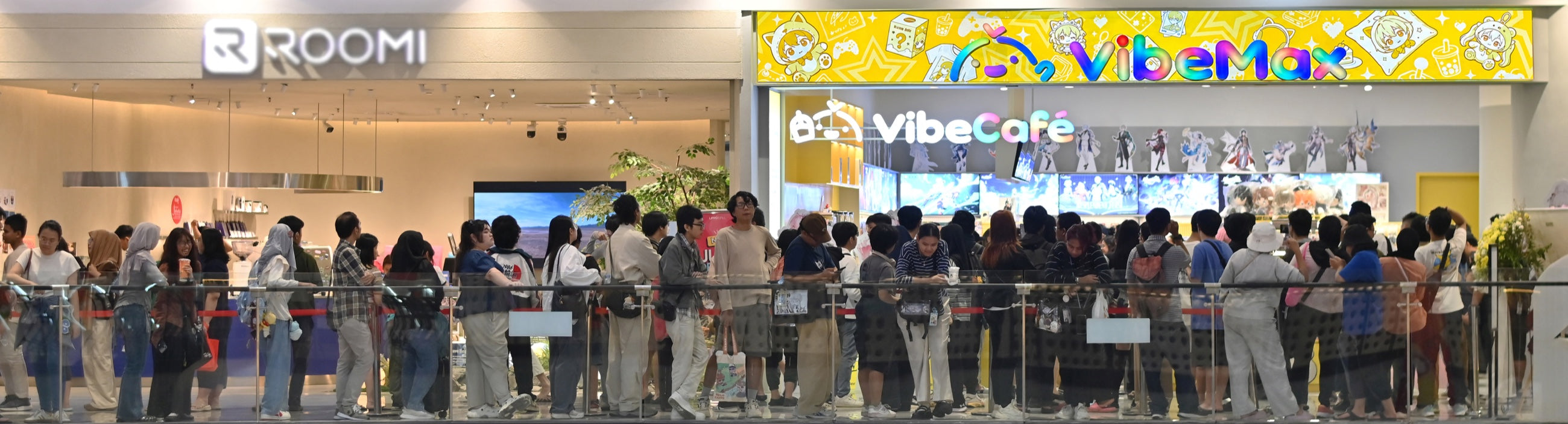 Enthusiastic customers queueing outside the VibeMax and VibeCafe retail destination